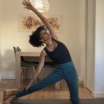 Yoga instructor practicing Gate Pose.