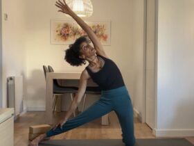 Yoga instructor practicing Gate Pose.