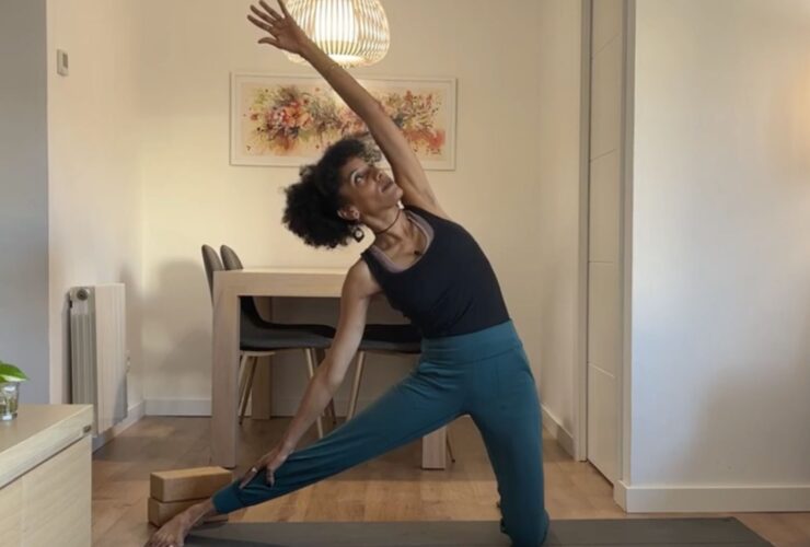 Yoga instructor practicing Gate Pose.