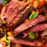 Smoky steak with caponata butterbeans recipe