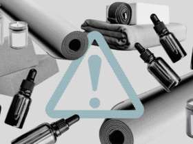 Yoga props like yoga mats, blocks, blankets, essential oils, and candles with a toxic chemicals sign