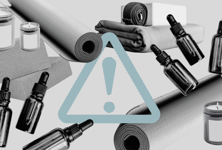 Yoga props like yoga mats, blocks, blankets, essential oils, and candles with a toxic chemicals sign