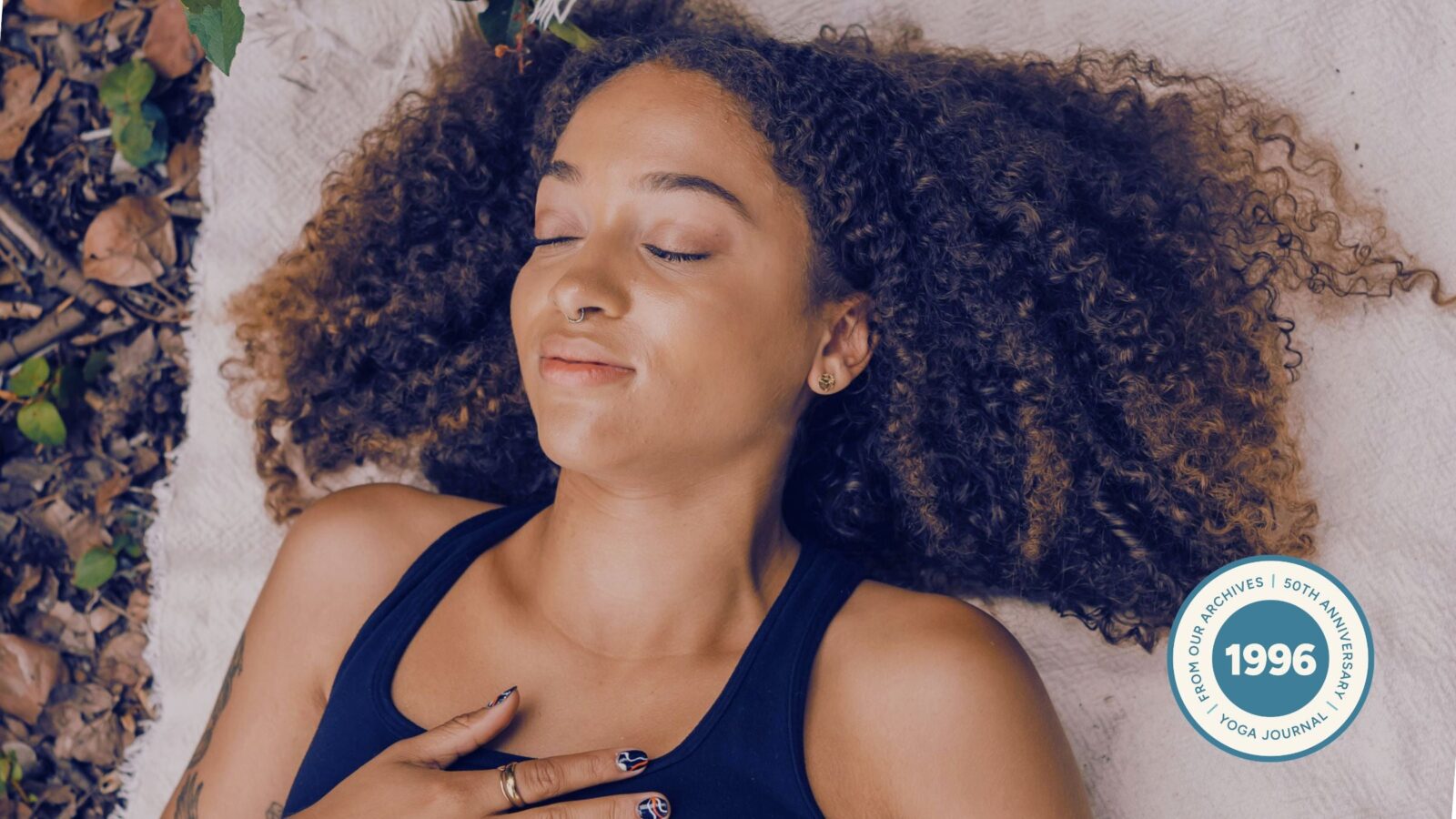 Woman practicing Ujjayi breath in nature.