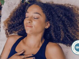 Woman practicing Ujjayi breath in nature.