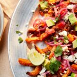 Black bean chilli fries with pickled red onion, feta & lime